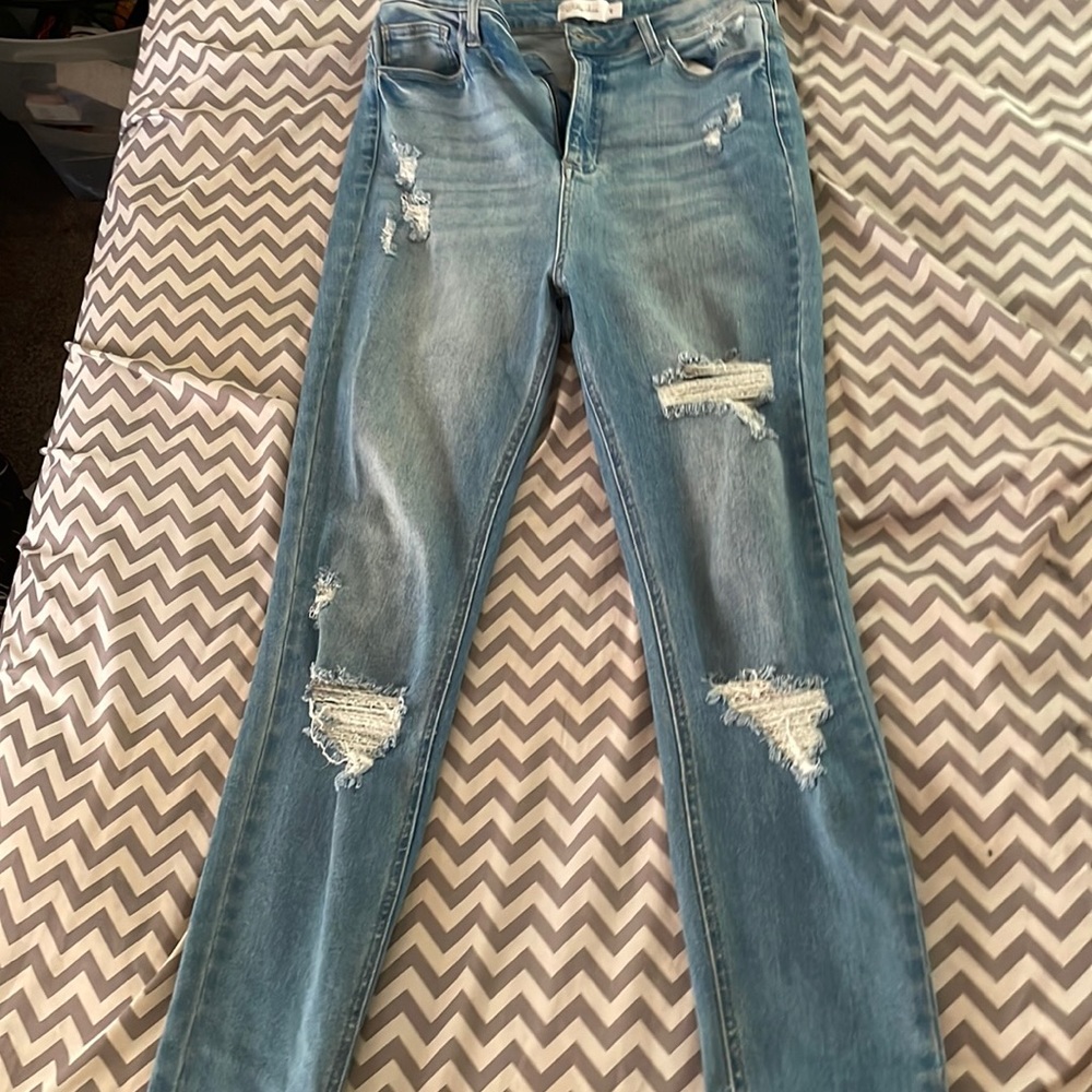 Light blue ripped jeans